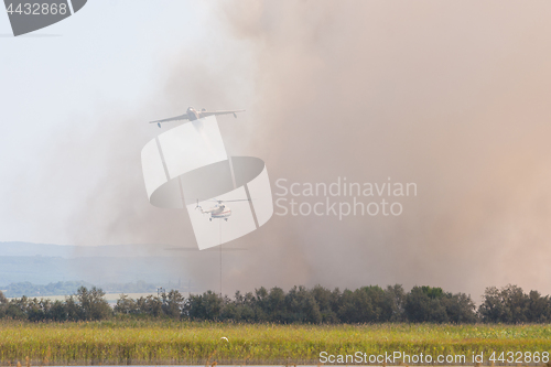 Image of Joint firefighting by airplane and helicopter, on the floodplains of the Anapka River, Anapa, Russia