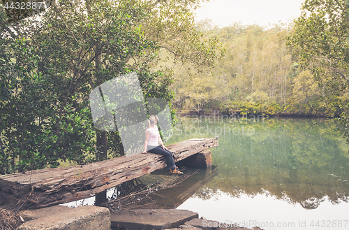 Image of Rustic large hewn timber jetty in Australian bushland