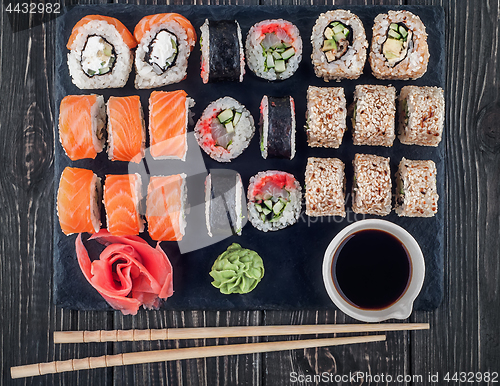 Image of Various sushi rolls on slate