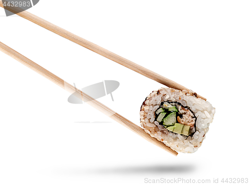 Image of Sushi roll of california with chopsticks