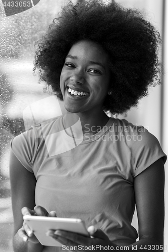 Image of african american woman using tablet