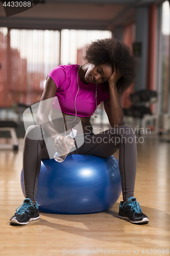 Image of woman  relaxing after pilates workout