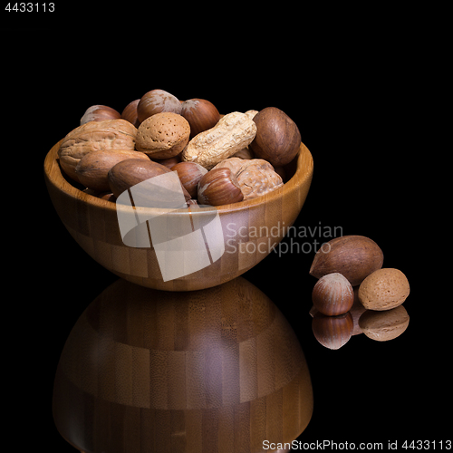 Image of Nuts in wooden bowl. 