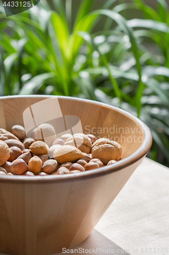 Image of Nuts in wooden bowl