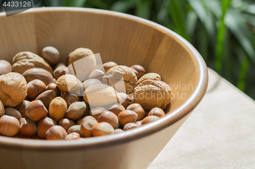 Image of Nuts in wooden bowl