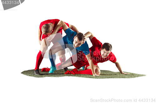 Image of Football players tackling for the ball over white background