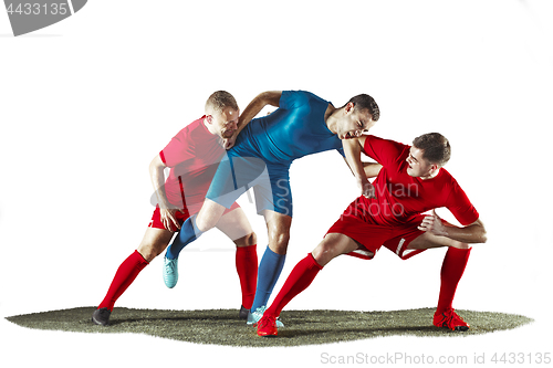 Image of Football players tackling for the ball over white background