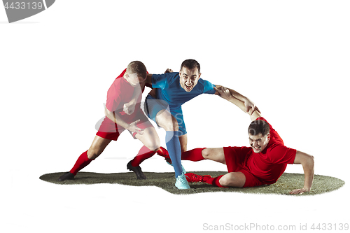 Image of Football players tackling for the ball over white background