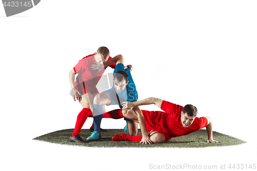 Image of Football players tackling for the ball over white background