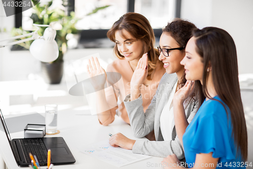 Image of businesswomen having video chat at office