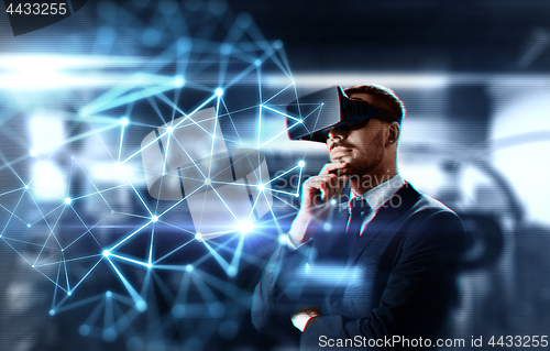 Image of businessman with virtual headset and network
