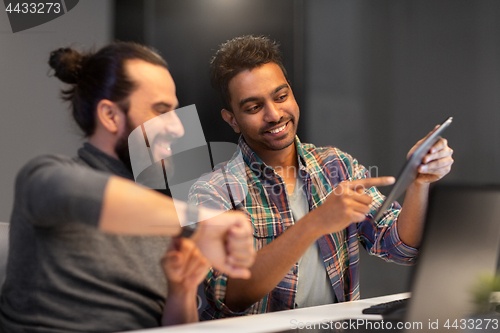 Image of creative team with tablet pc working at office