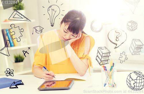 Image of bored asian woman student with tablet pc at home