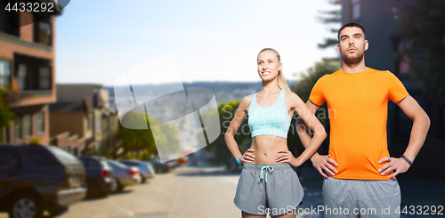 Image of happy couple doing sports at san francisco city