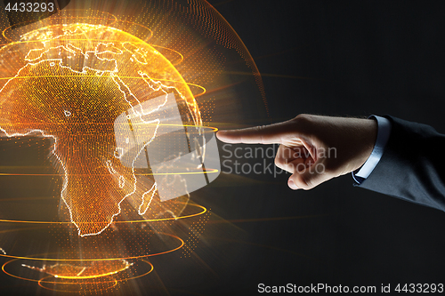 Image of close up of businessman hand with earth hologram