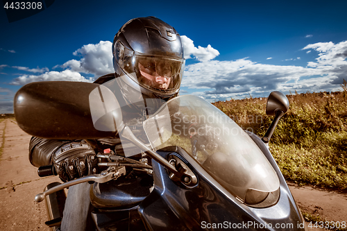 Image of Biker racing on the road