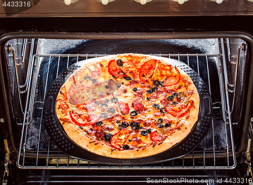 Image of Appetizing pizza in the oven.
