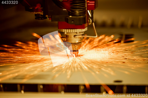 Image of CNC Laser cutting of metal, modern industrial technology.