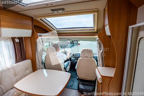 Image of Man driving on a road in the Camper Van RV