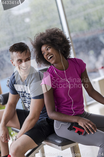 Image of couple in a gym have break