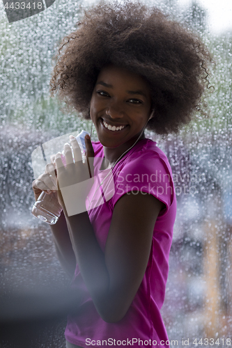 Image of portrait of young afro american woman in gym