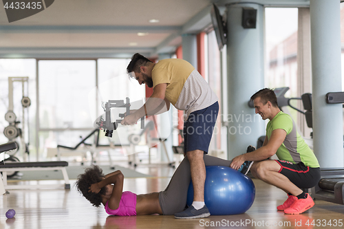 Image of pilates  workout with personal trainer at gym