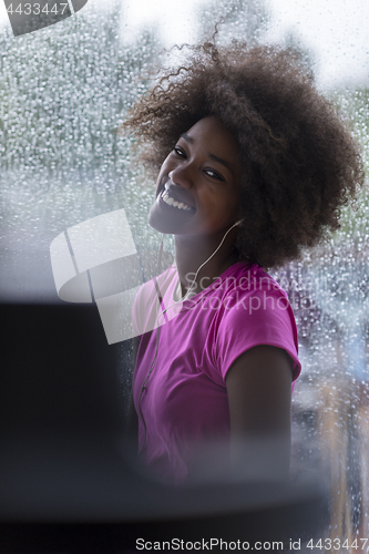 Image of portrait of young afro american woman in gym