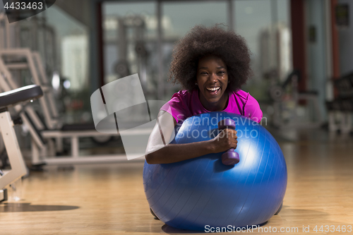 Image of woman  relaxing after pilates workout