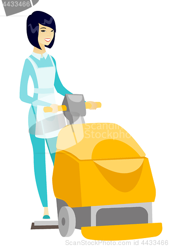 Image of Asian worker cleaning store floor with machine.