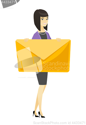 Image of Smiling business woman holding a big envelope.