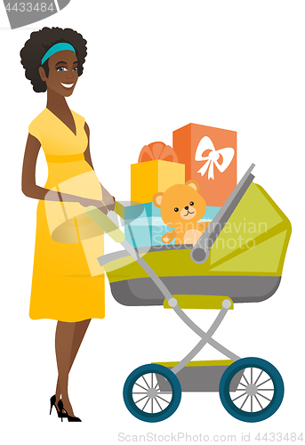 Image of Young pregnant woman with a pram full of presents.