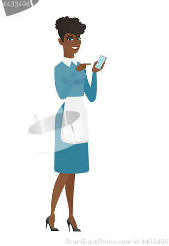 Image of African cleaner holding a mobile phone.