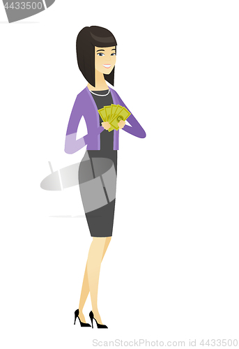 Image of Happy asian business woman holding money.