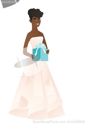 Image of Woman in a white bridal dress holding a gift box.