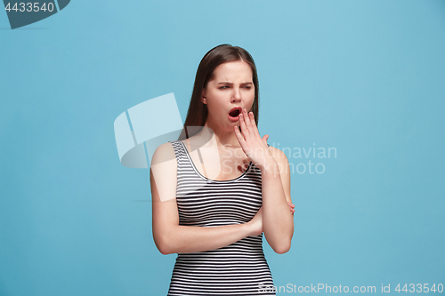 Image of Beautiful bored woman bored isolated on blue background