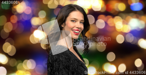 Image of happy beautiful young woman in black party dress