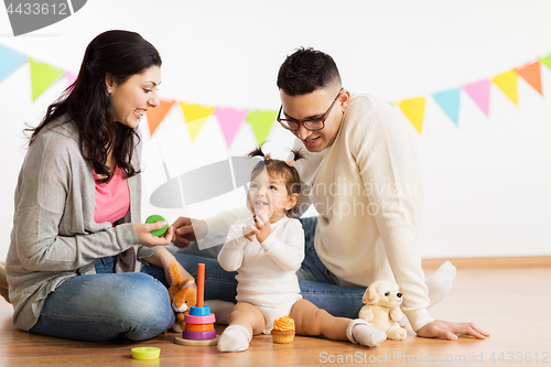 Image of baby girl with parents playing with toys