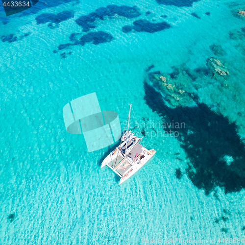 Image of Drone aerial view of catamaran sailing boat in Maddalena Archipelago, Sardinia, Italy.