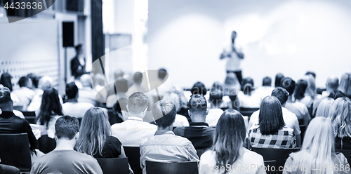 Image of Business speaker giving a talk at business conference event.