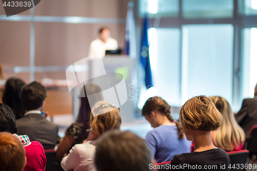 Image of Business speaker giving a talk at business conference event.