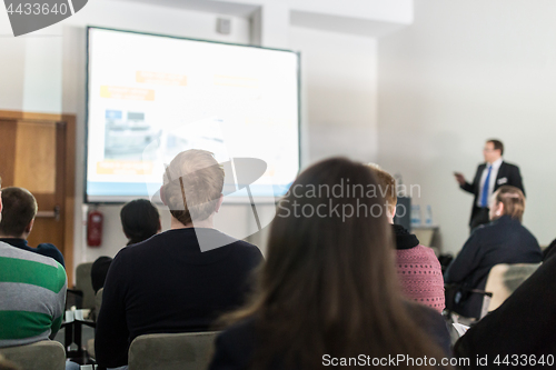 Image of Business speaker giving a talk at business conference event.