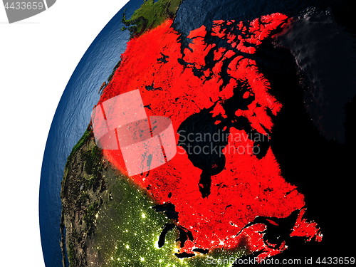 Image of Canada in red on Earth at night