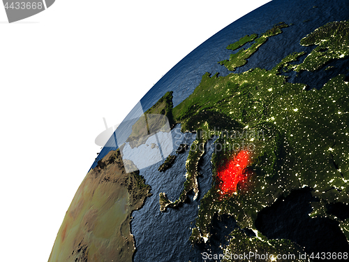 Image of Serbia in red on Earth at night