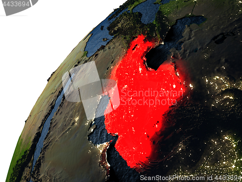 Image of Iran in red on Earth at night