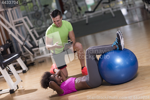 Image of pilates  workout with personal trainer at gym