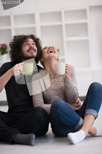 Image of young couple in their new home