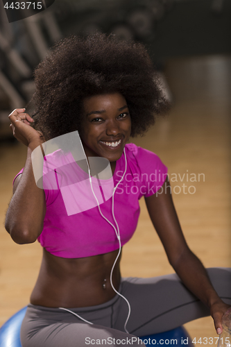 Image of woman  relaxing after pilates workout