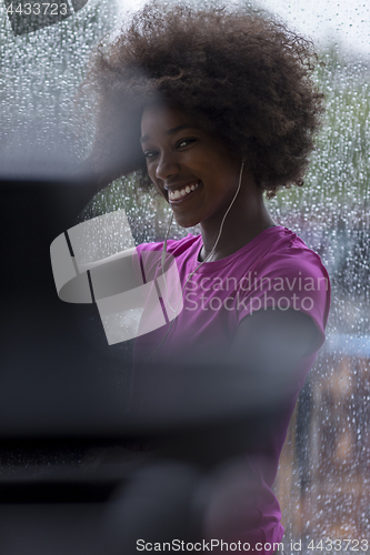 Image of portrait of young afro american woman in gym