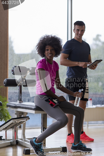 Image of couple in a gym have break