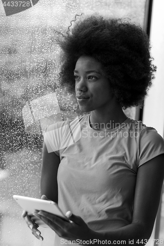Image of african american woman using tablet